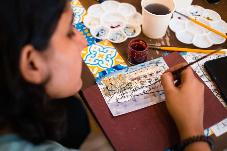 team member doing painting