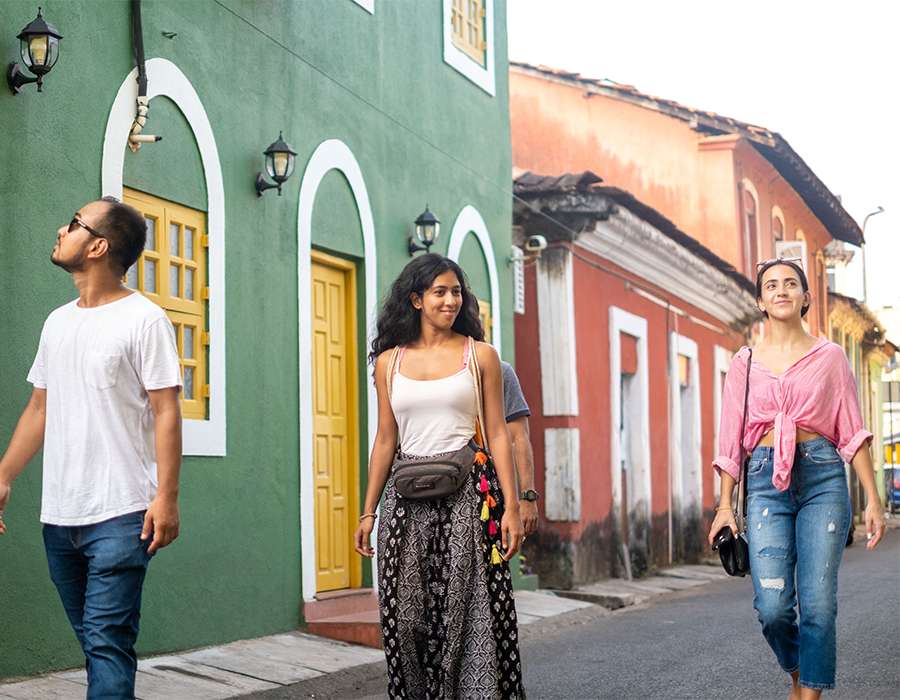 Tourists enjoying a walking tour in Goa.