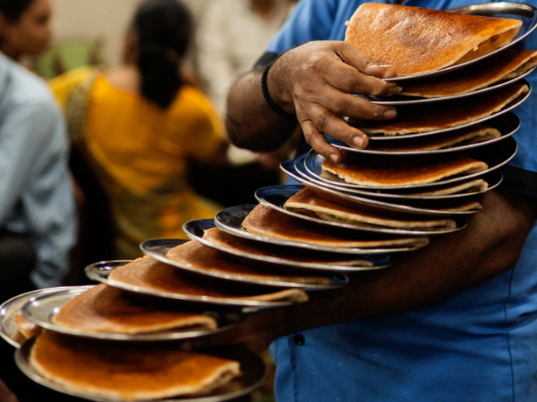 Tourists enjoying a walking tour in Goa.